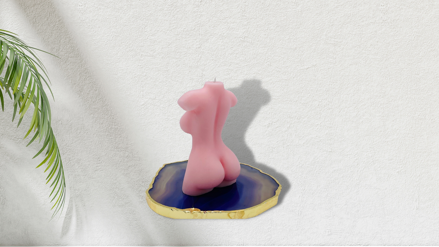 Scented female torso candle in light pink. Cruelty-free and vegan, made with soy wax.  
