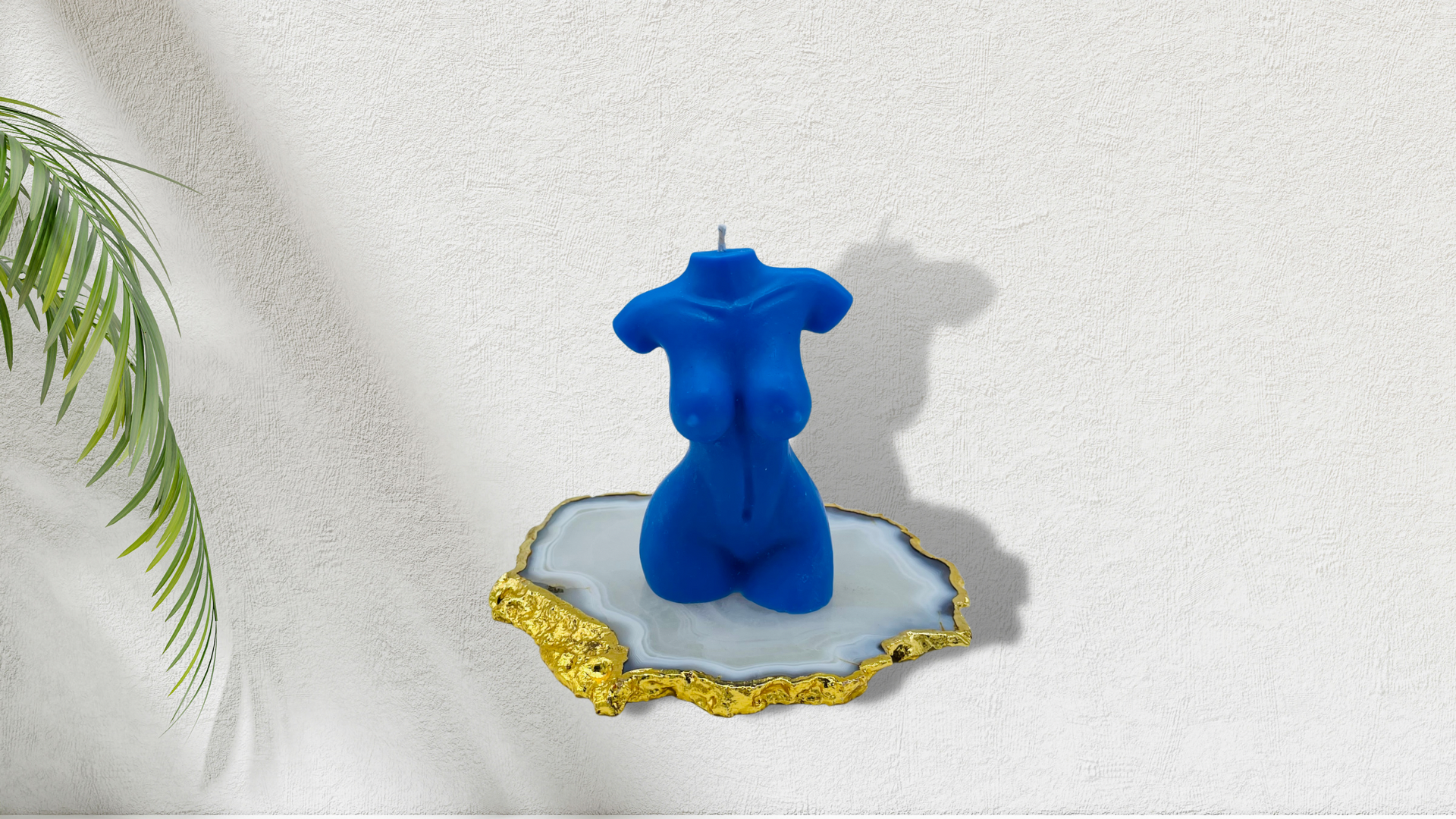 Scented female torso candle in blue. Cruelty-free and vegan, made with soy wax.  