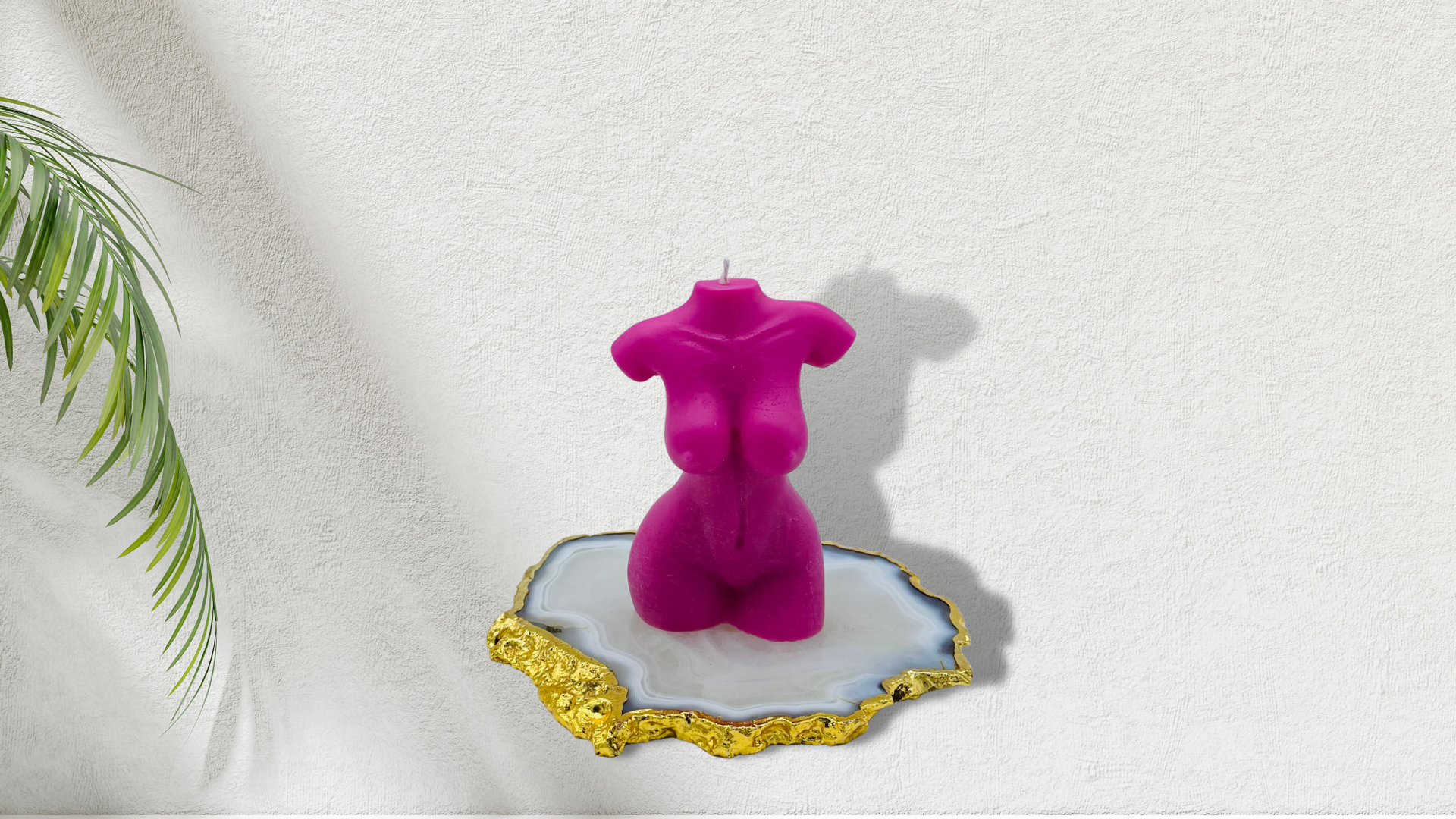 Scented female torso candle in pink. Cruelty-free and vegan, made with soy wax.  