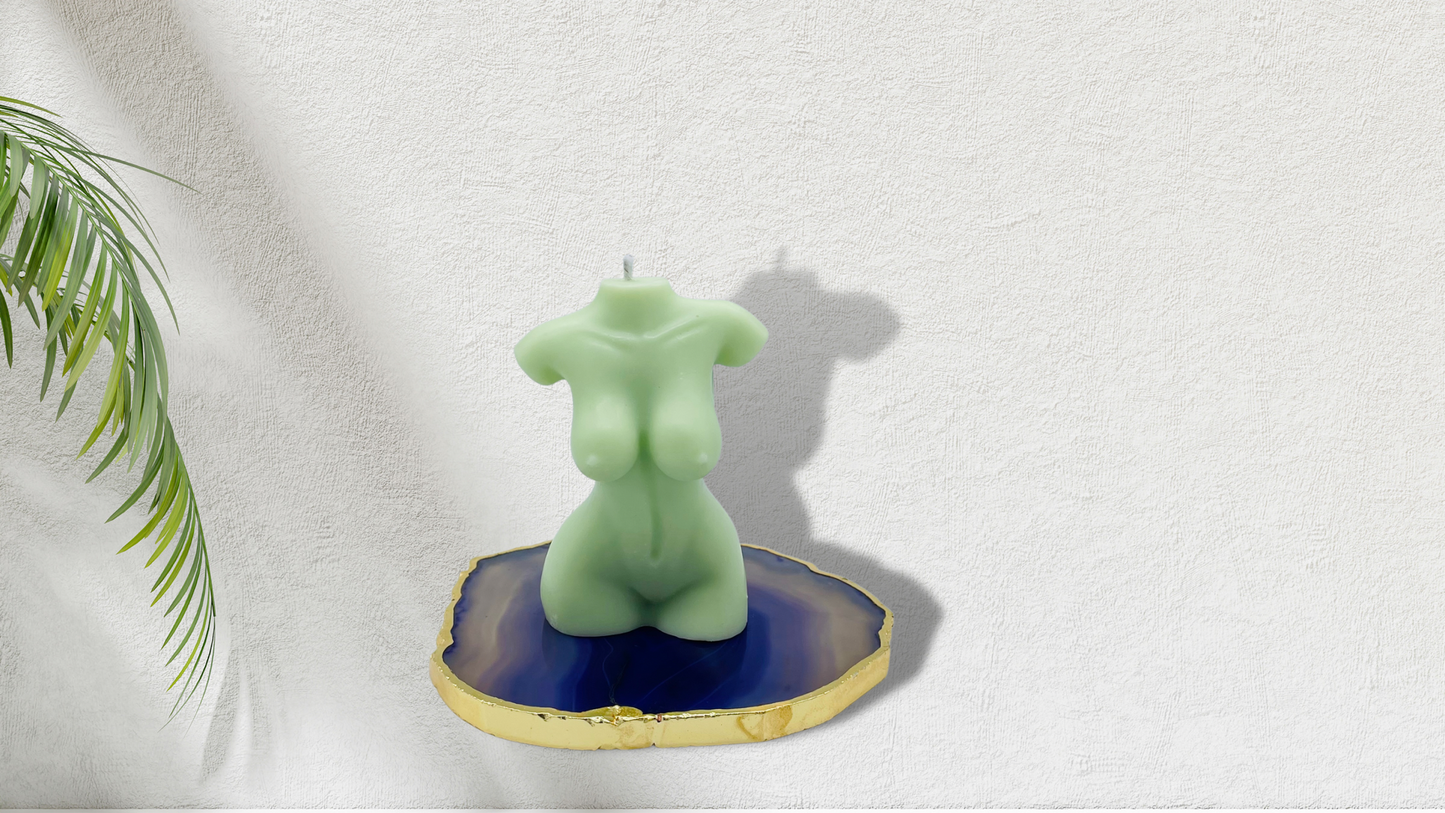 Scented female torso candle in light green. Cruelty-free and vegan, made with soy wax.  