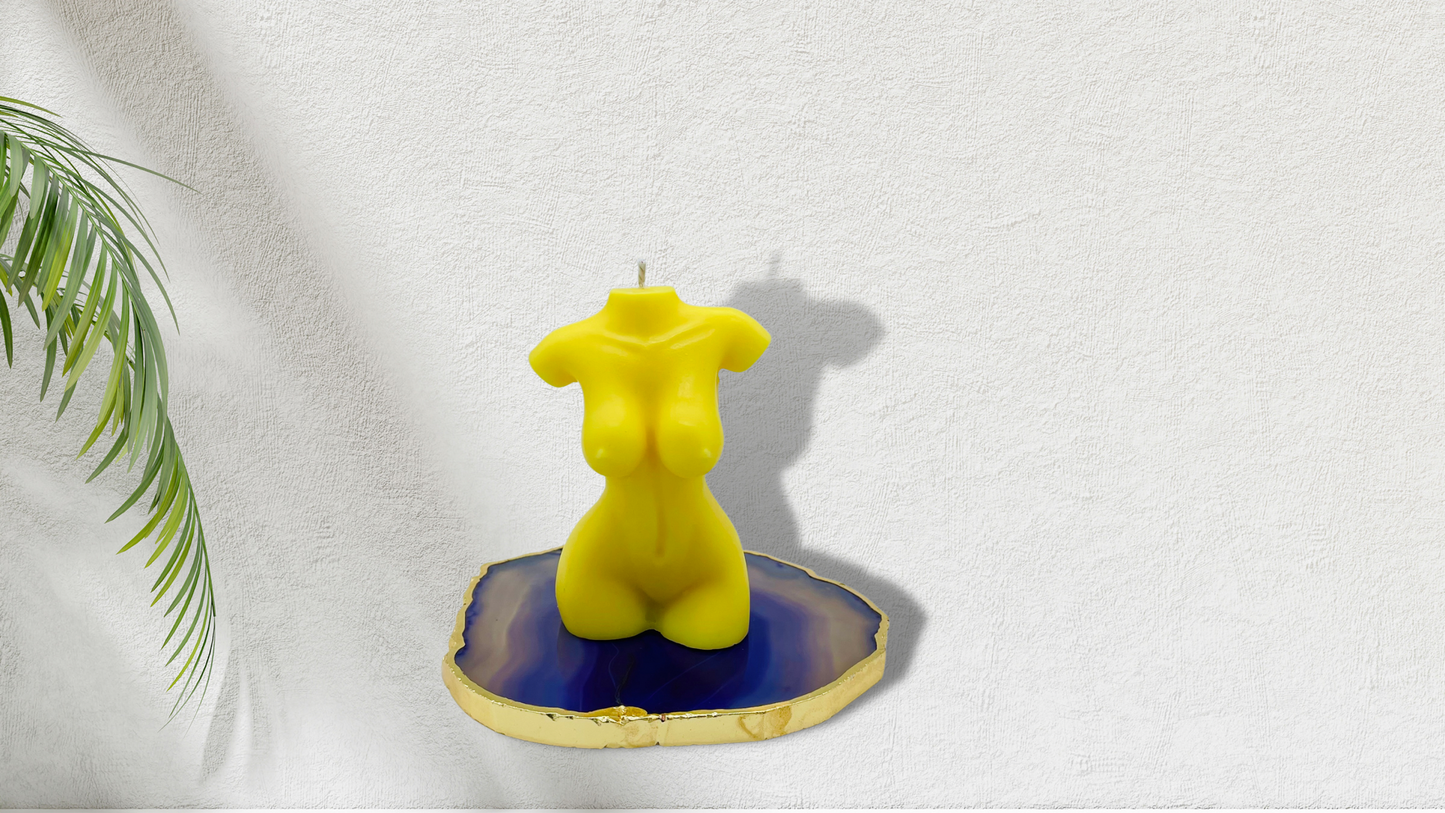 Scented female torso candle in yellow. Cruelty-free and vegan, made with soy wax.  
