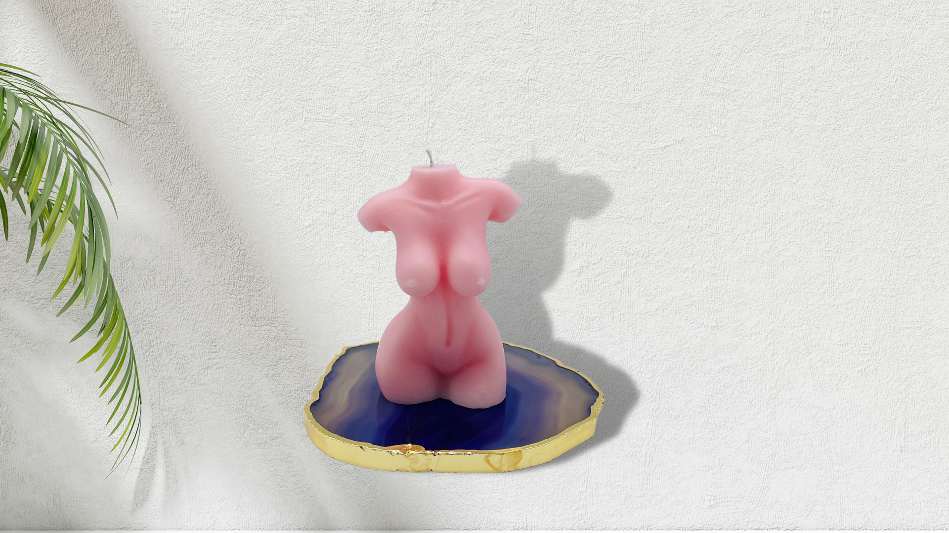 Scented female torso candle in light pink. Cruelty-free and vegan, made with soy wax.  